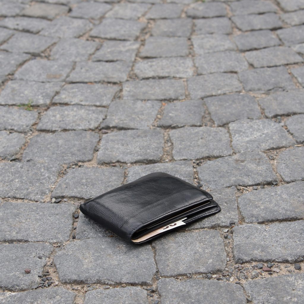 lost wallet on cobblestone street